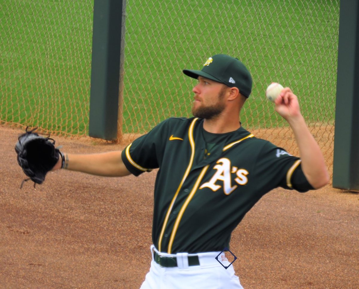 Cody Stull throwing in his Oakland Athletics uniform during his professional career